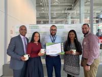 Five Columbia Nursing staff members holding a sustainability award.